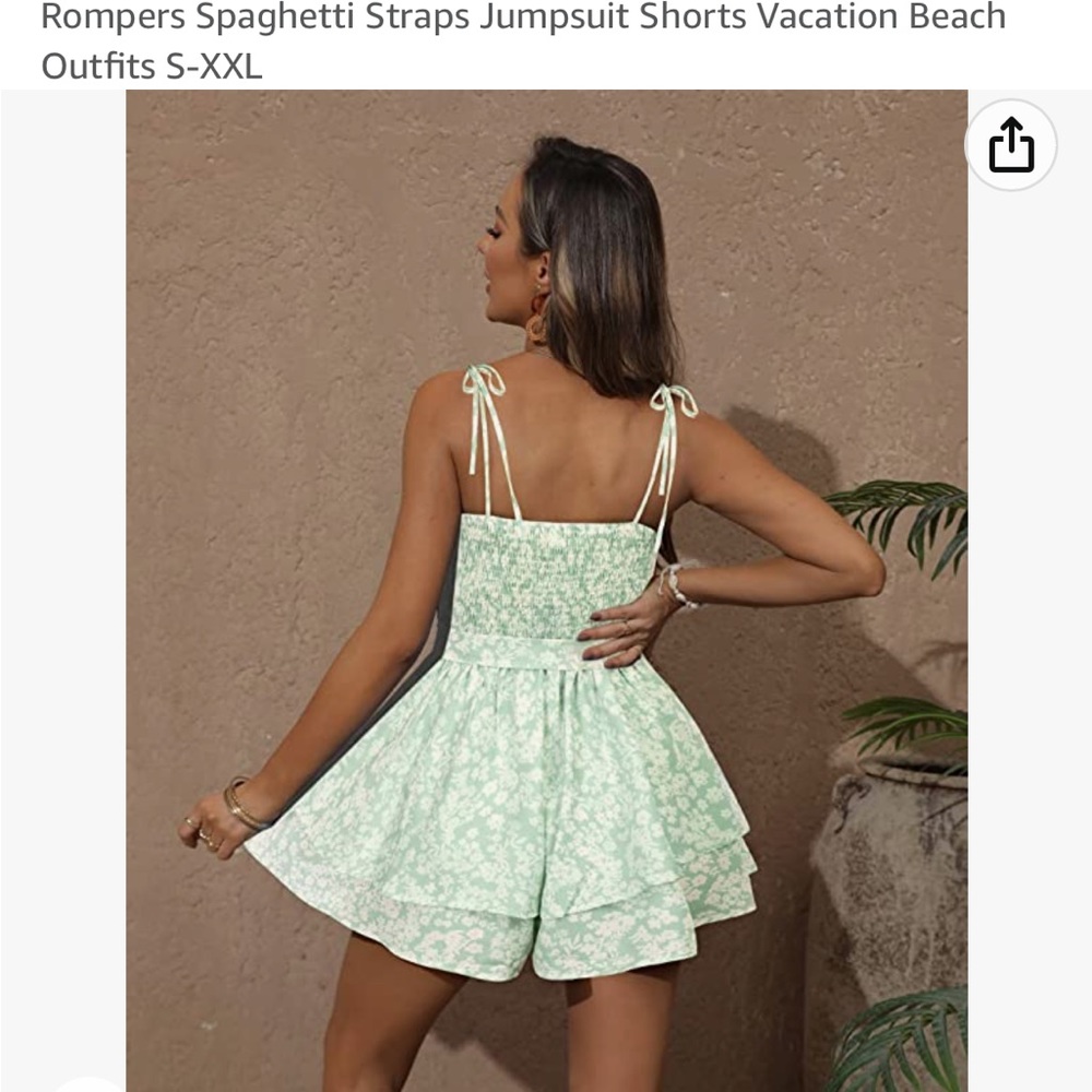 NWT light green floral romper with spaghetti straps.